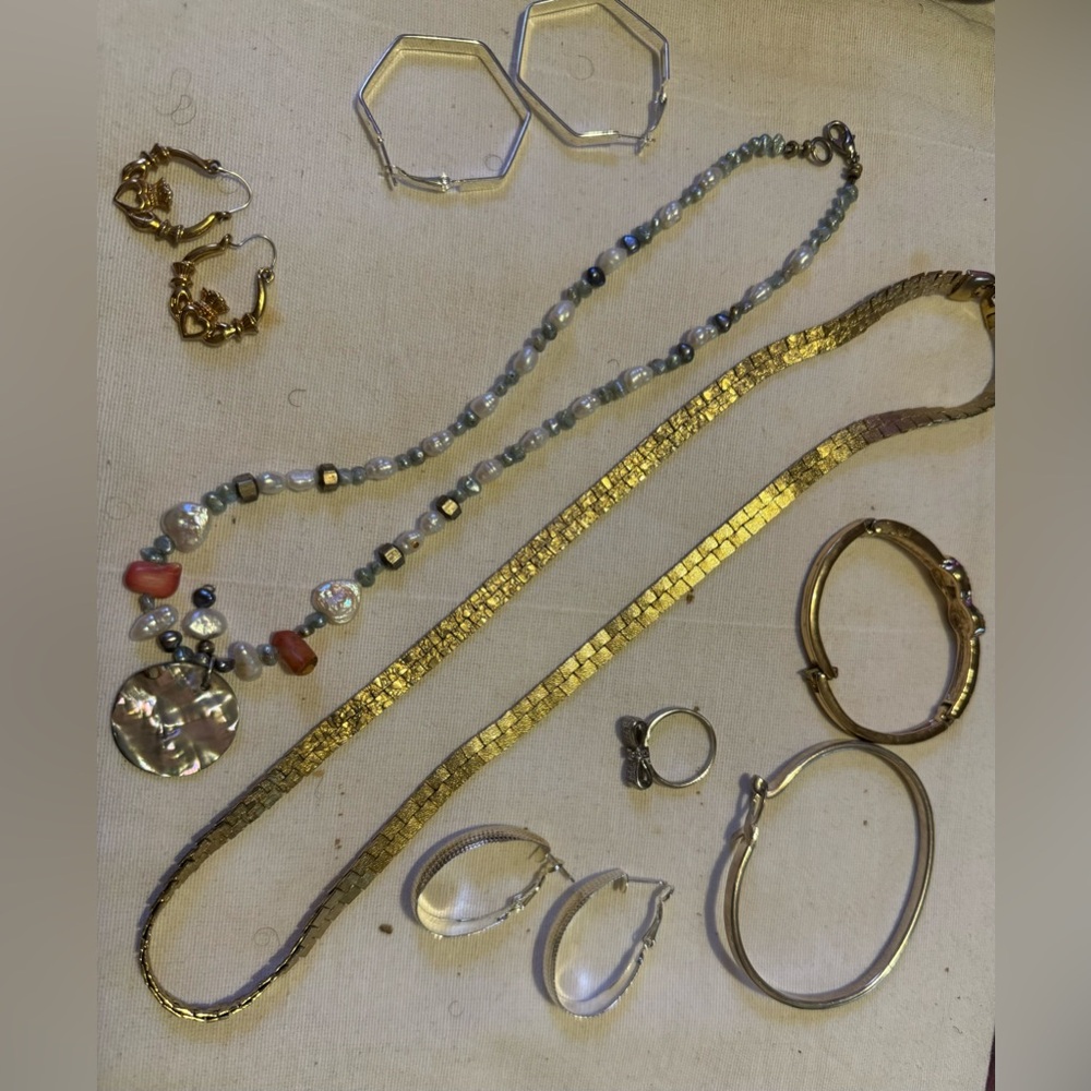 Variety of costume jewelry 2 necklaces3 sets of earrings2 bracelets and one ring